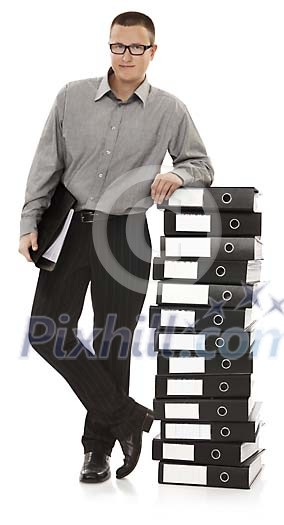 Man leaning on a pile of office folders