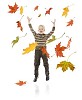 Boy throwing colourful autumn leaves
