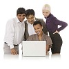 Multicultural group behind laptop