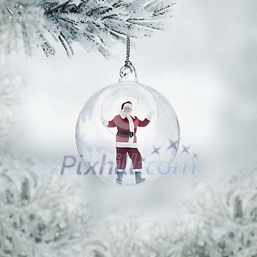 Santa Claus in a transparent christmas ball hanging on a frozen fir outside seen through the window