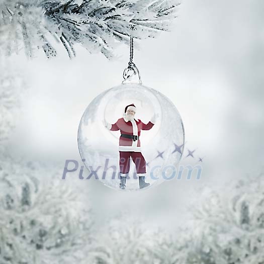 Santa Claus in a transparent christmas ball hanging on a frozen fir outside seen through the window Santa Claus in a transparent christmas ball hanging on a frozen fir outside seen through the window