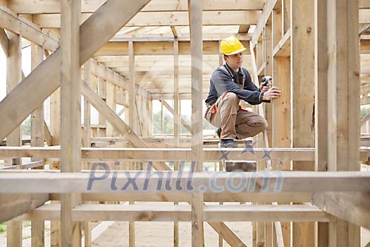 Construction worker working with a drill