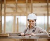 Female constructor looking at camera