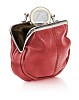 One euro coin dropping into red leather purse