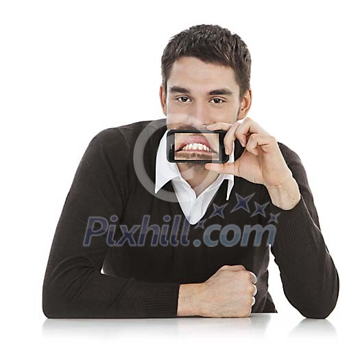 Young man showing photo on mobile