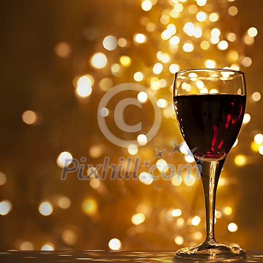 Red wine glass under lights
