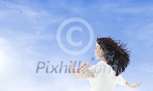 Woman relaxing outdoors in wind and sun