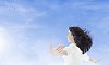 Woman relaxing outdoors in wind and sun