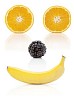Orange, blackberry and banana forming a smiling face