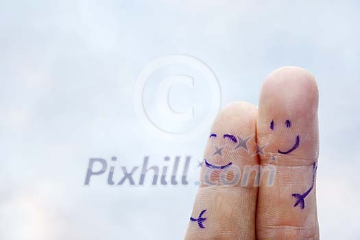 Fingers with faces holding and smiling