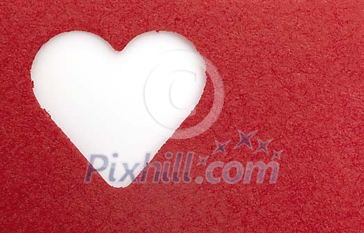 Heart shape cutted out of the red paper