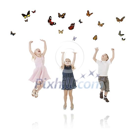 Kids jumping to reach the butterflies above