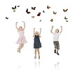 Kids jumping to reach the butterflies above