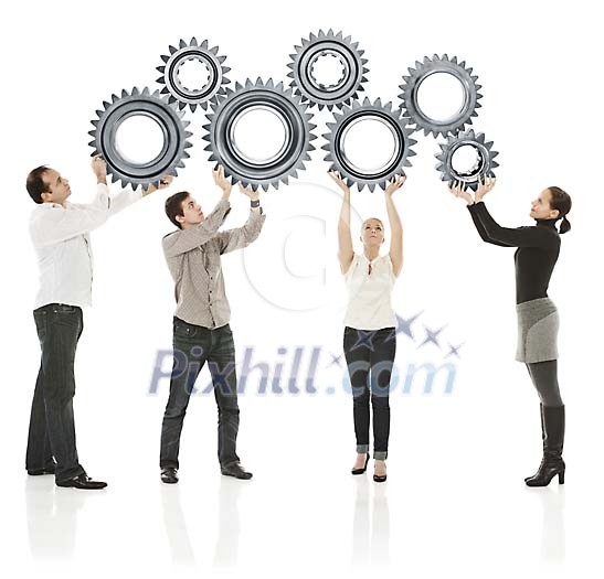 Teammembers holding up a set of cog wheels