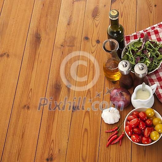 Salad ingredients on wooden background
