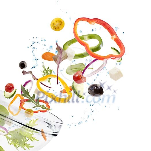 Salad ingredients falling into bowl Salad ingredients falling into bowl