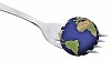 Globe on a the tip of a fork