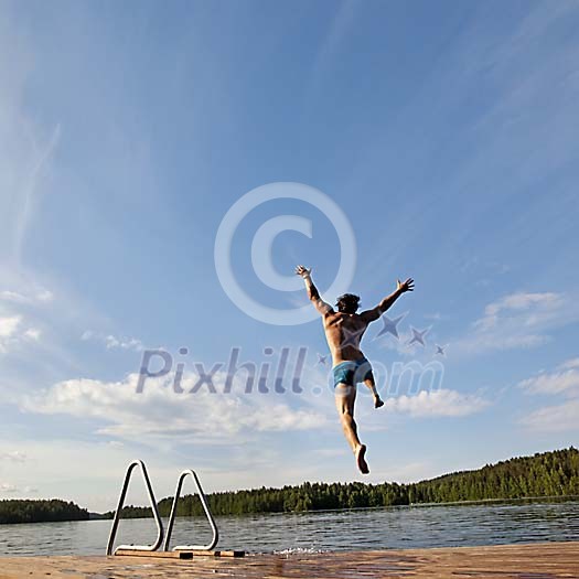 Male diving into the lake Male diving into the lake