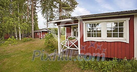 Red cottages in the country Red cottages in the country