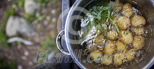 Potatoes in boiling water outdoors Potatoes in boiling water outdoors