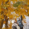 Boy trying to grab yellow autumn leaves