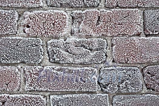 Frozen brick wall