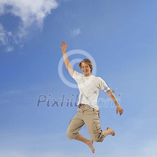 Male jumping on blue sky