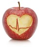 Isolated apple with heart and heartbeat cut out 