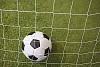 Soccer ball behind the net