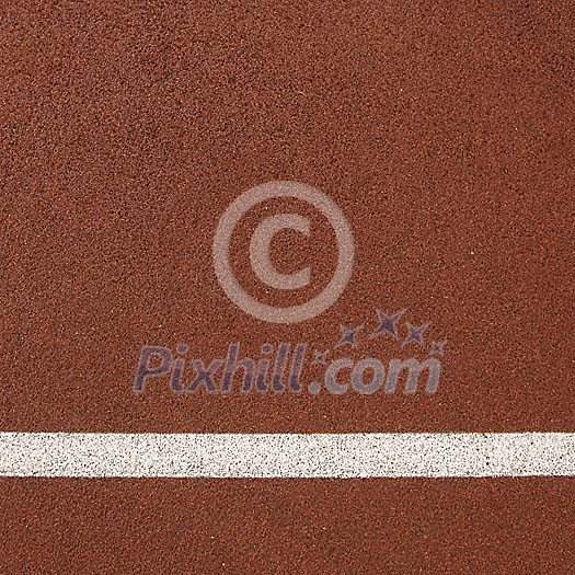 Red running track with white line