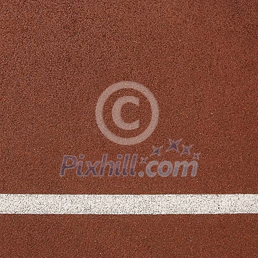 Red running track with white line Red running track with white line