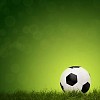 Football with grass on green background