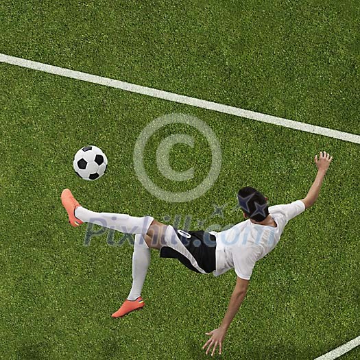Soccer player in mid air hitting ball Soccer player in mid air hitting ball