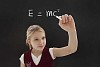Student girl chalking mass–energy equivalence