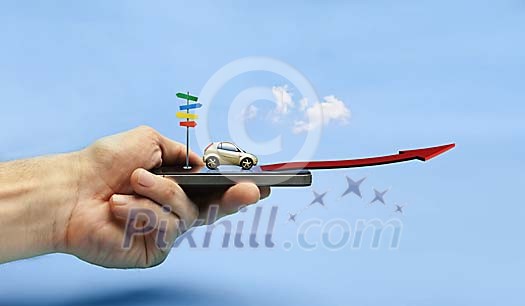 Hand holding a smartphone with driving directions Hand holding a smartphone with driving directions