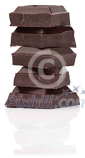 Isolated dark chocolate pieces piled up Isolated dark chocolate pieces piled up