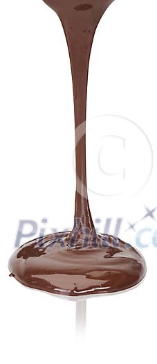 Isolated melted chocolate dripping on the table