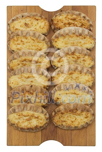 Isolated karelian pasty on a cutting board Isolated karelian pasty on a cutting board