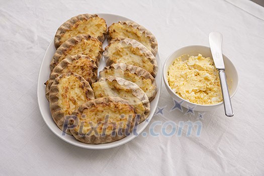 Karelian pasty with a bowl of egg butter