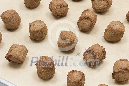 Meatballs on an oven pan Meatballs on an oven pan