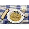 Pea soup with bread and a glass of milk