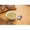 Bowl of pea soup with rye bread