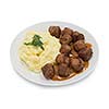 Isolated plate of mash potatoes with meatballs and sauce