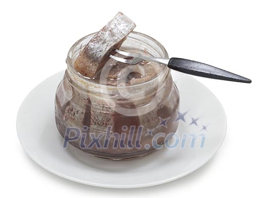 Isolated jar of herring with a fork Isolated jar of herring with a fork