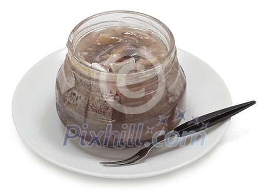 Isolated jar of herring with a fork Isolated jar of herring with a fork