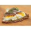 Rye bread with boiled eggs and herring