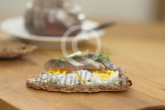 Rye bread with boiled eggs and herring