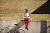 Man sitting on the grass with a laptop