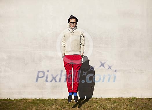 Hipster man jumping up outside Hipster man jumping up outside