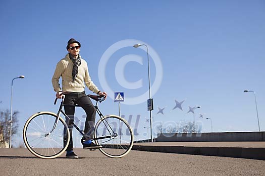 Man with a bike outside